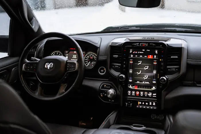 Free Close-up view of Dodge Ram 1500 Rebel truck dashboard and steering wheel in a modern interior. Stock Photo